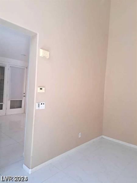 clothes washing area featuring baseboards