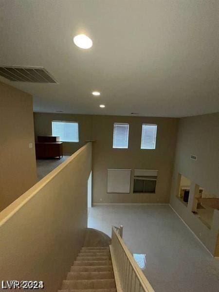 staircase featuring recessed lighting and visible vents