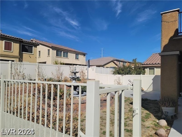 view of yard with a residential view and a fenced backyard