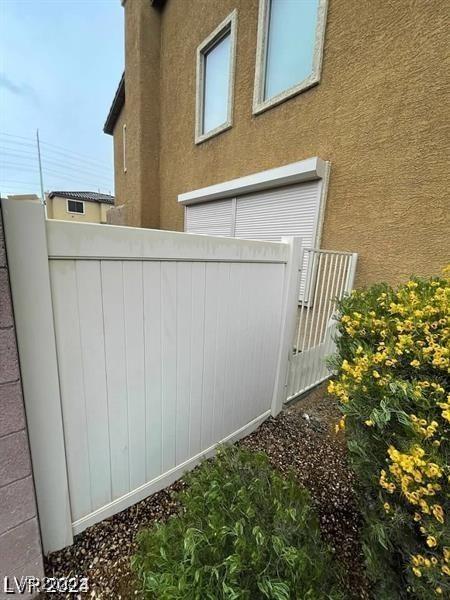 view of home's exterior featuring fence and stucco siding