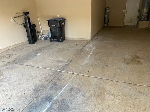 garage with water heater and gas water heater