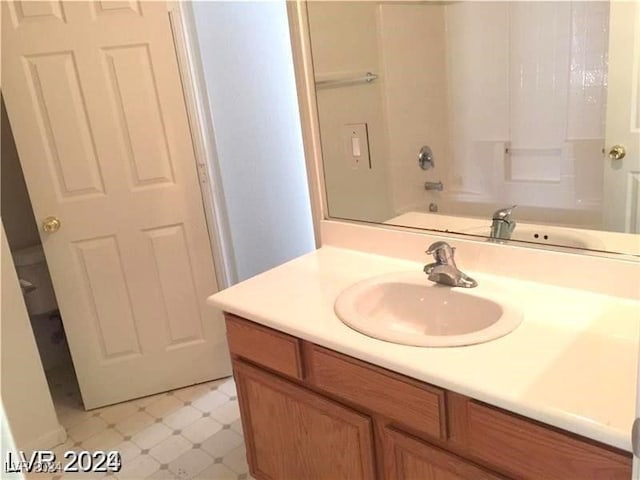 bathroom with tile patterned floors, tub / shower combination, and vanity