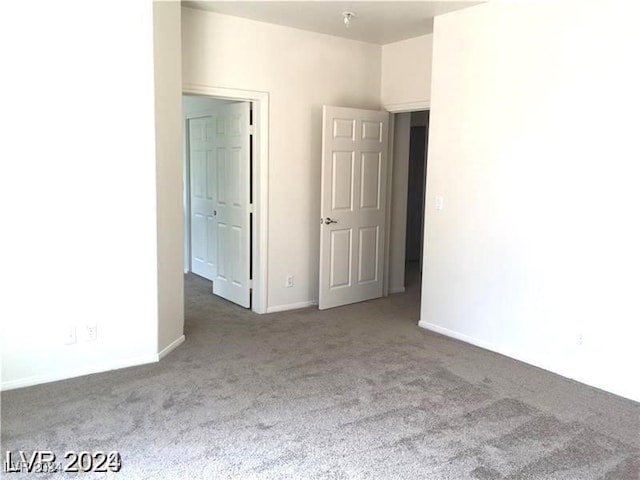 unfurnished bedroom with carpet