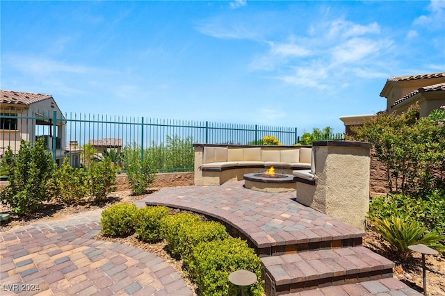 view of patio featuring a fire pit