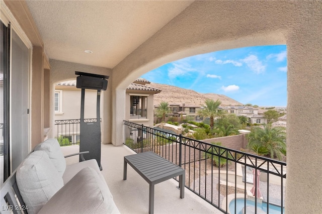 balcony featuring a mountain view