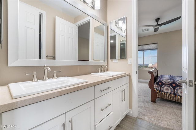 bathroom featuring ceiling fan and vanity