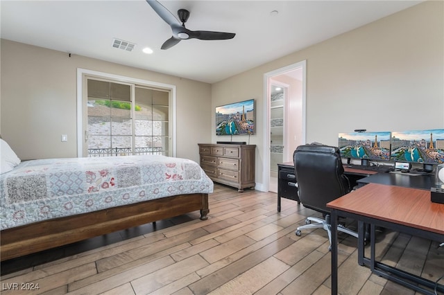 bedroom featuring light hardwood / wood-style floors and ceiling fan