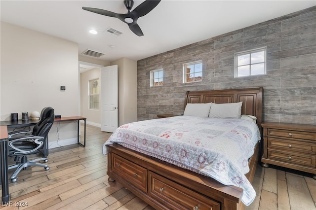 bedroom featuring light hardwood / wood-style floors and ceiling fan