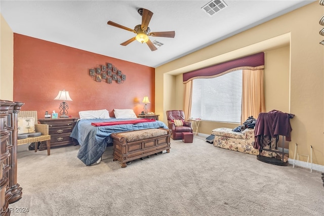 bedroom with ceiling fan and light carpet