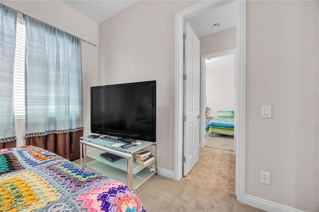 bedroom with light colored carpet