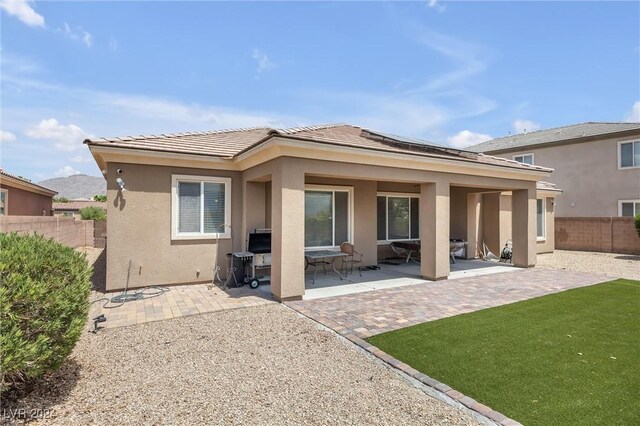 back of house featuring a patio