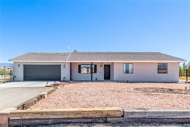 ranch-style home featuring a garage