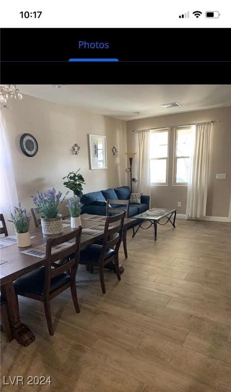 dining area with wood-type flooring