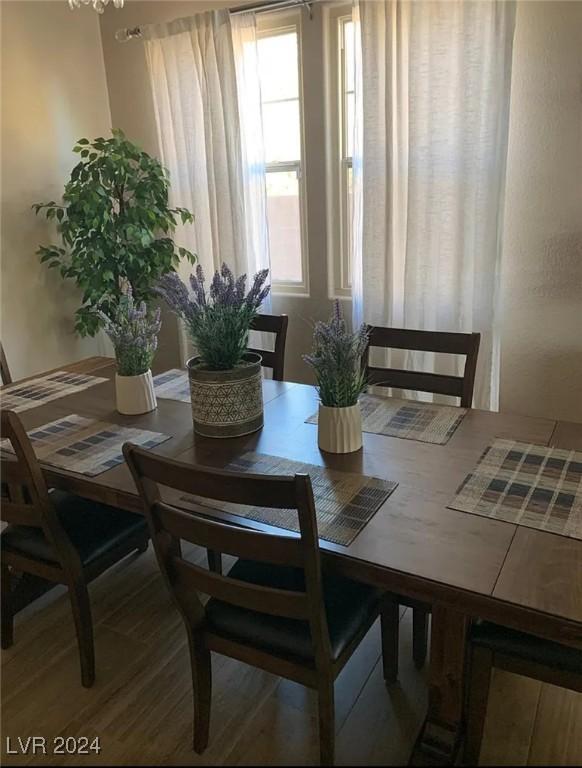 dining space featuring hardwood / wood-style floors