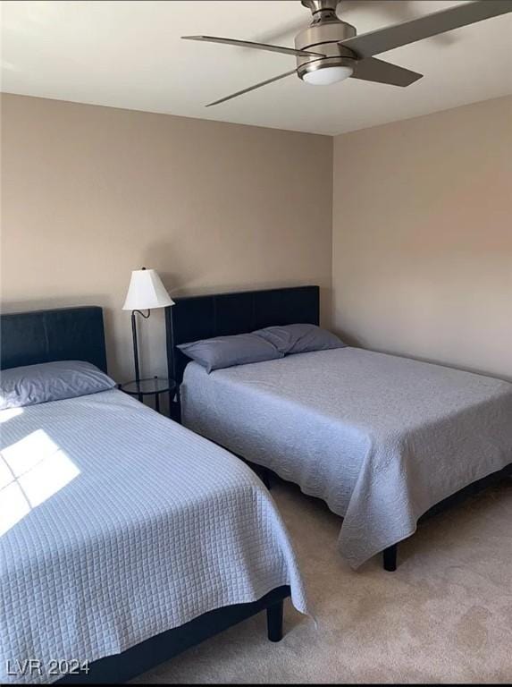 bedroom with ceiling fan and carpet floors