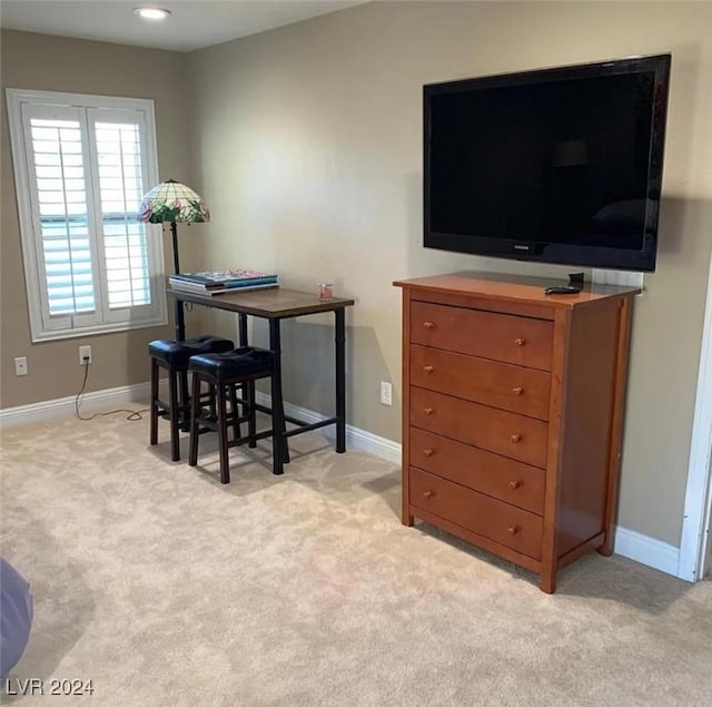 dining room featuring light colored carpet