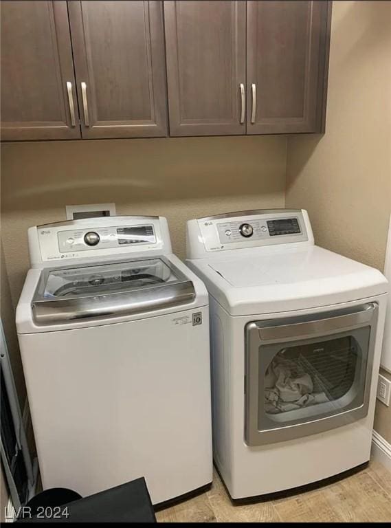 laundry area featuring cabinets and washer and dryer