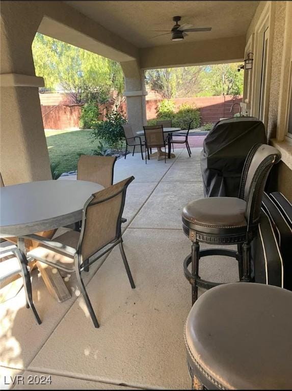 view of patio featuring ceiling fan