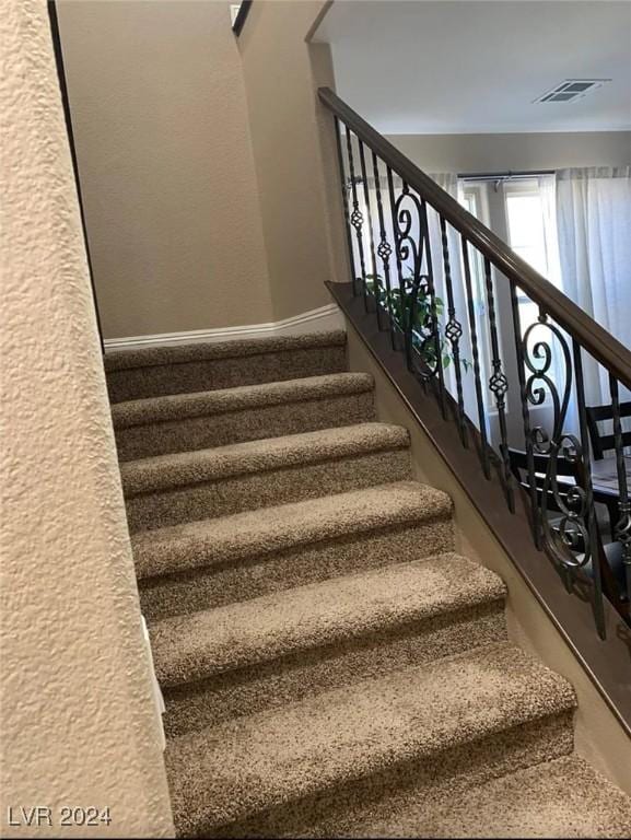 5301 Fairbranch Ln, Las Vegas, NV 89135 - stairway with visible vents and baseboards