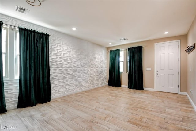 5301 Fairbranch Ln, Las Vegas, NV 89135 - unfurnished room featuring baseboards, light wood-style flooring, and visible vents