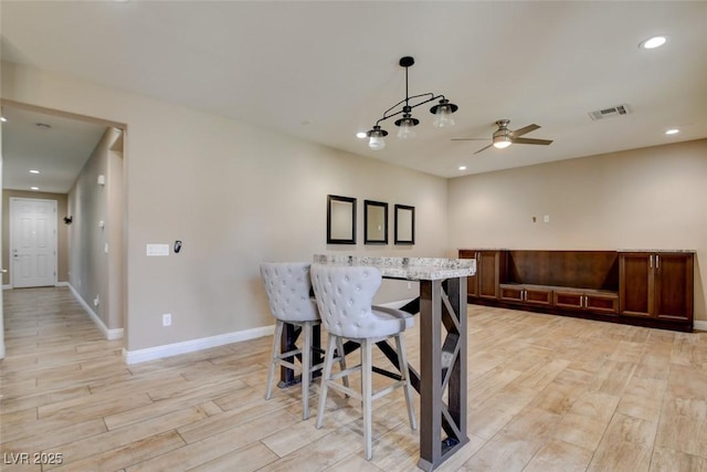 5301 Fairbranch Ln, Las Vegas, NV 89135 - dining room with visible vents, light wood-style floors, baseboards, ceiling fan, and recessed lighting