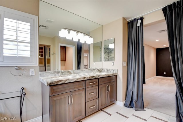 5301 Fairbranch Ln, Las Vegas, NV 89135 - full bath featuring double vanity, baseboards, visible vents, and a sink