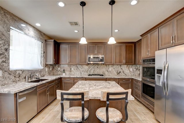 5301 Fairbranch Ln, Las Vegas, NV 89135 - kitchen with appliances with stainless steel finishes, a sink, recessed lighting, backsplash, and visible vents