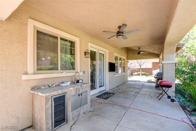 5301 Fairbranch Ln, Las Vegas, NV 89135 - view of patio with a sink, ceiling fan, and wine cooler