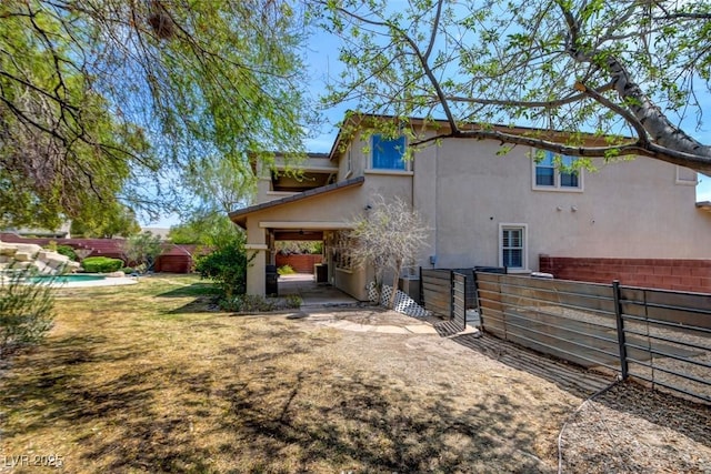 5301 Fairbranch Ln, Las Vegas, NV 89135 - view of property exterior with a fenced backyard and stucco siding