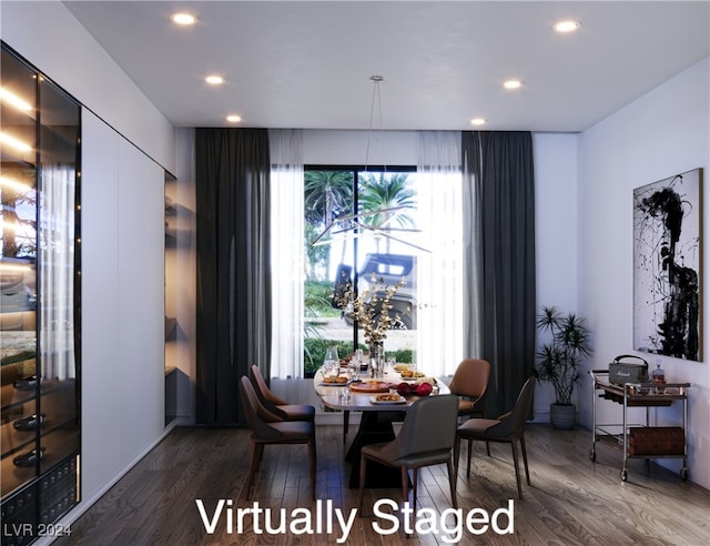 dining space featuring a healthy amount of sunlight and hardwood / wood-style flooring