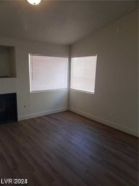 empty room with hardwood / wood-style flooring