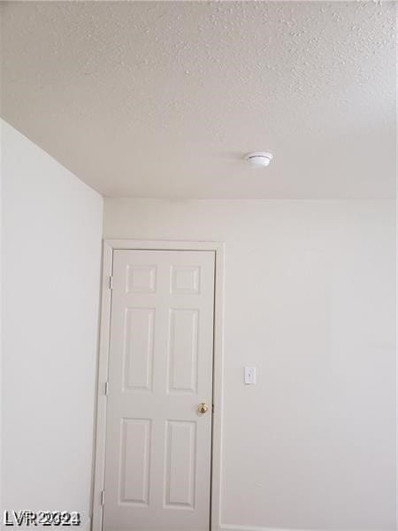 interior space featuring a textured ceiling