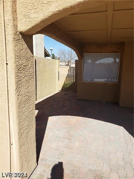 view of patio featuring fence