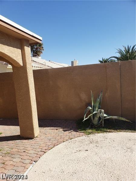 view of yard featuring a patio and fence