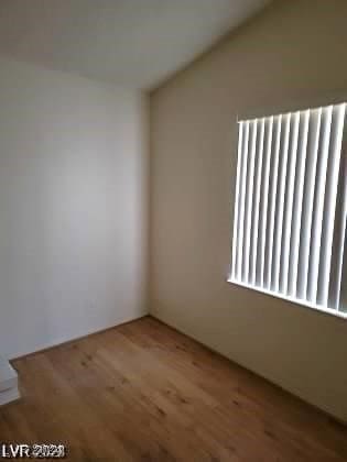 spare room featuring hardwood / wood-style floors