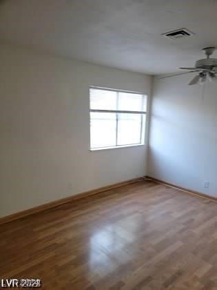 unfurnished room featuring wood-type flooring and ceiling fan