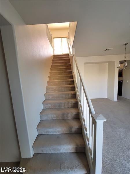 stairway with carpet floors