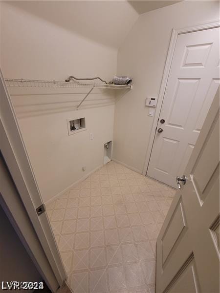 laundry area featuring tile patterned floors, washer hookup, baseboards, hookup for an electric dryer, and laundry area