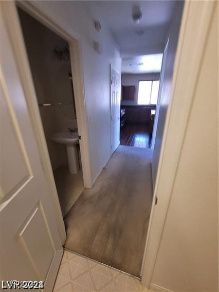 hallway with wood finished floors