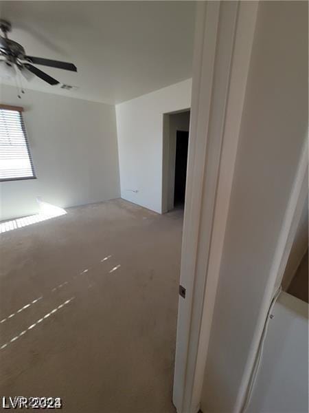 unfurnished room with ceiling fan