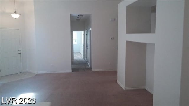 unfurnished room with carpet floors