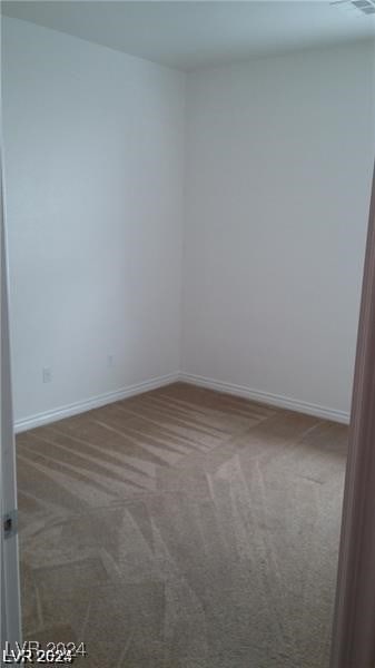 empty room featuring carpet floors