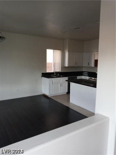 kitchen with sink and white cabinets