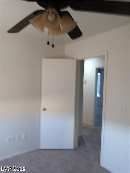 spare room with a ceiling fan