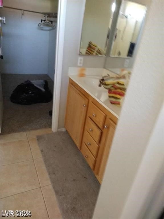 bathroom with vanity and tile patterned floors