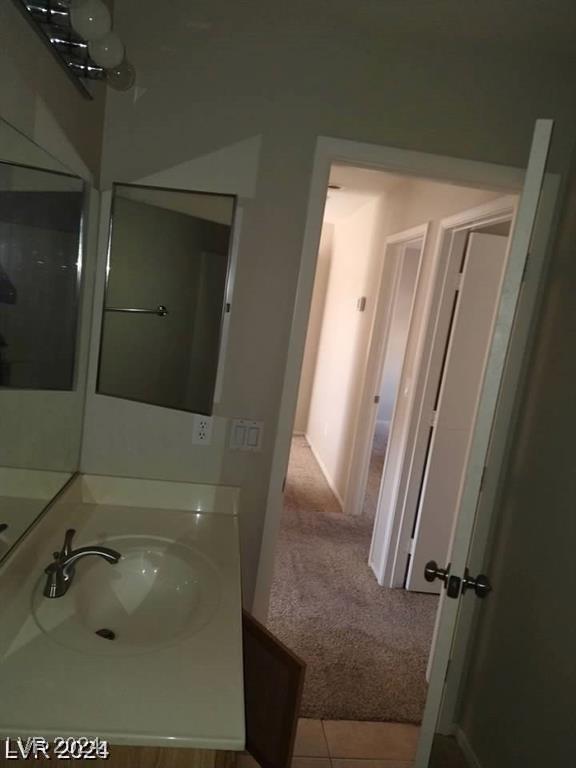 bathroom with vanity and tile patterned floors