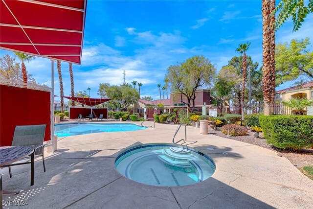 view of pool featuring a community hot tub