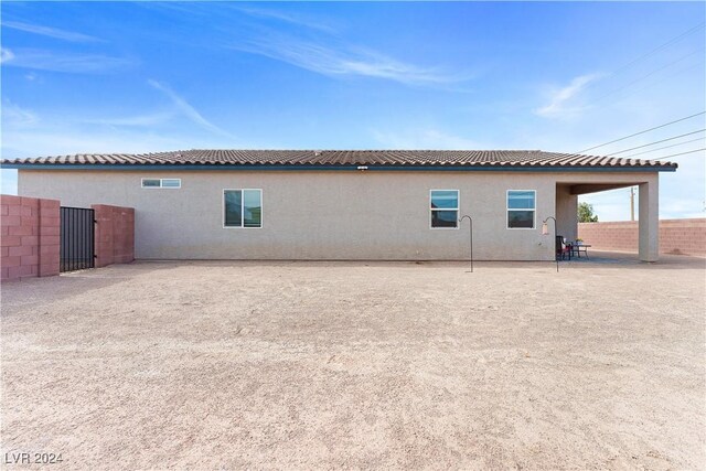 view of property exterior with a patio area