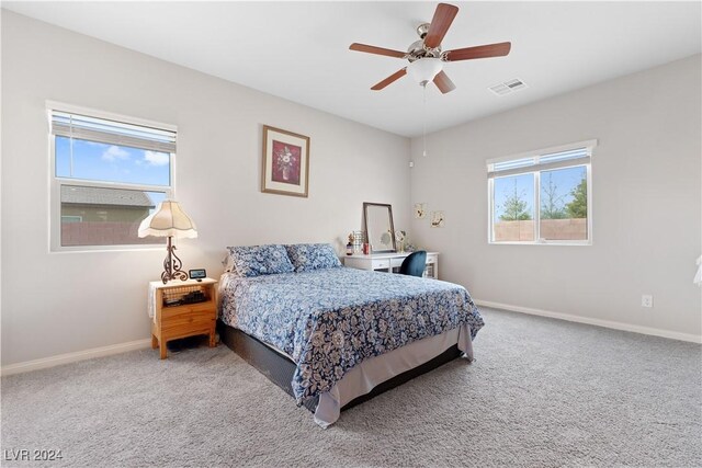 bedroom with ceiling fan and carpet