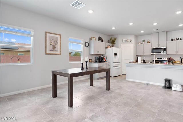 kitchen featuring white cabinetry and stainless steel appliances